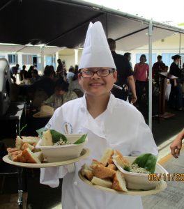 culinary student serving food