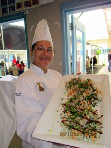 culinary student showing platter of food